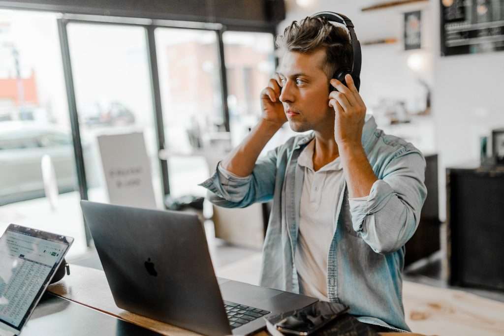 digital nomad jobs for beginners Man working in a job among the best digital nomad jobs for beginners